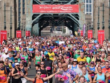 Crowds crossing the Tyne Bridge at the Great North Run. (Credit: Runner's World UK.)